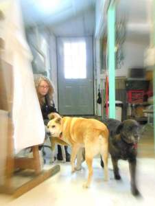 Elizabeth Lisa Petrulis in her studio with dogs Mookie and Dino.