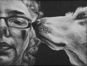 Intimate close up portrait in Black and white. Shows half womans face with glasses looking forward with dog in profile snout touching glasses.
