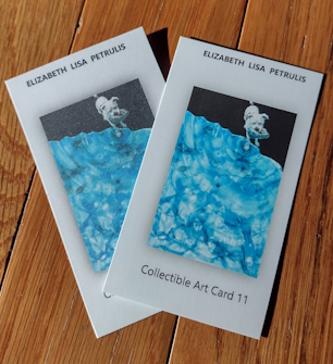 2 art cards displaying misaligned printing and comparing the print on standard (dull) and specialty (sharp) card stock.